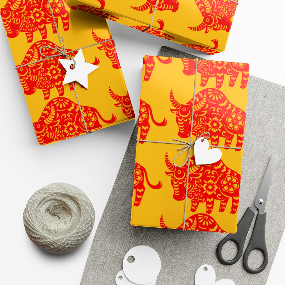 Thumbnail: Wrapped gifts with yellow paper and red ox pattern, string and scissors on table