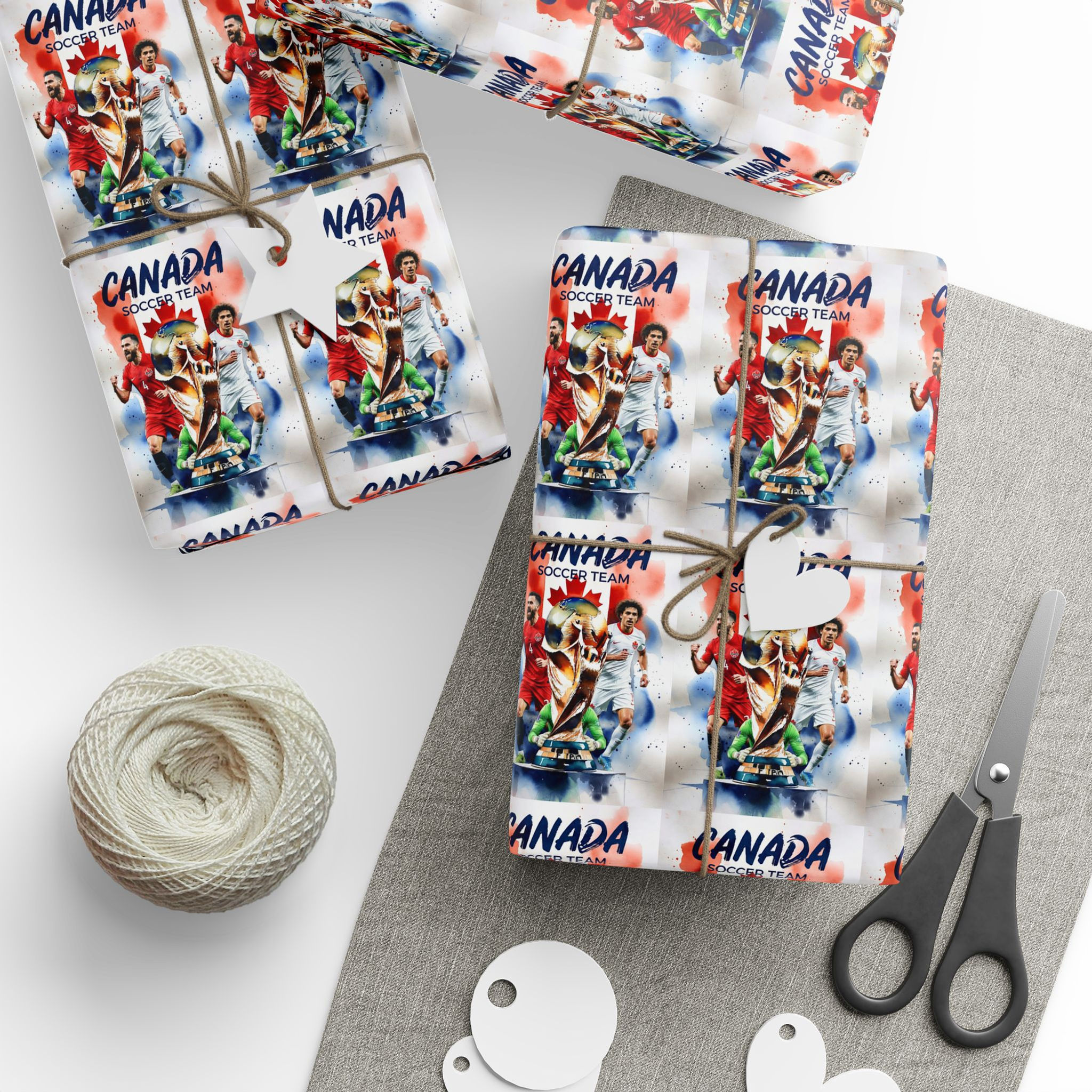 Wrapped gifts with Canada-themed paper, twine, scissors