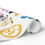 Thumbnail: A roll of wrapping paper with colorful icons and design.