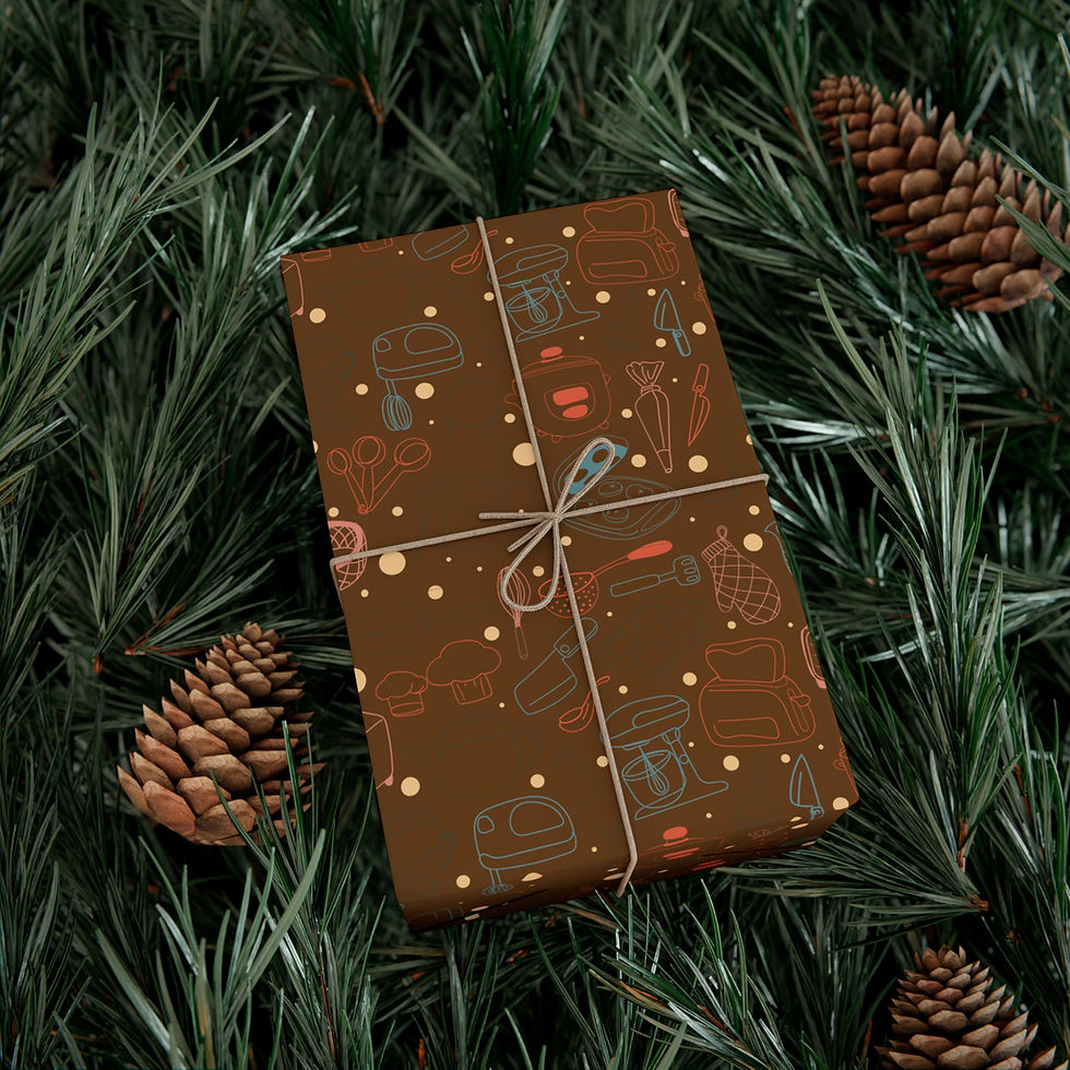 Thumbnail: Wrapped gift on pine needles with Brown Chef Kitchen Gift Wrapping Paper | Cooking Utensils and Foodie Gift Wrap.