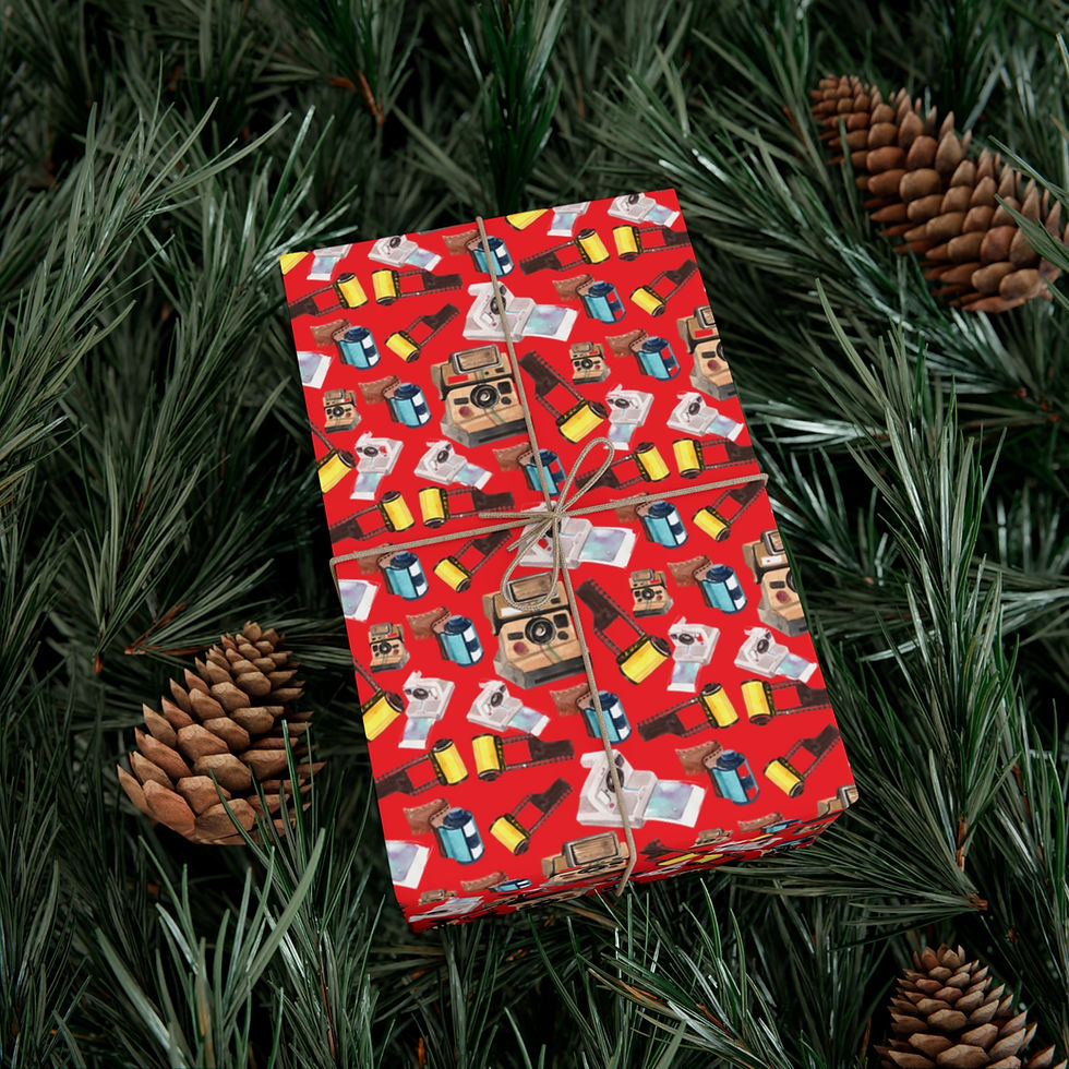 Thumbnail: Red-patterned gift wrap tied with twine, festive background of pine needles and cones.