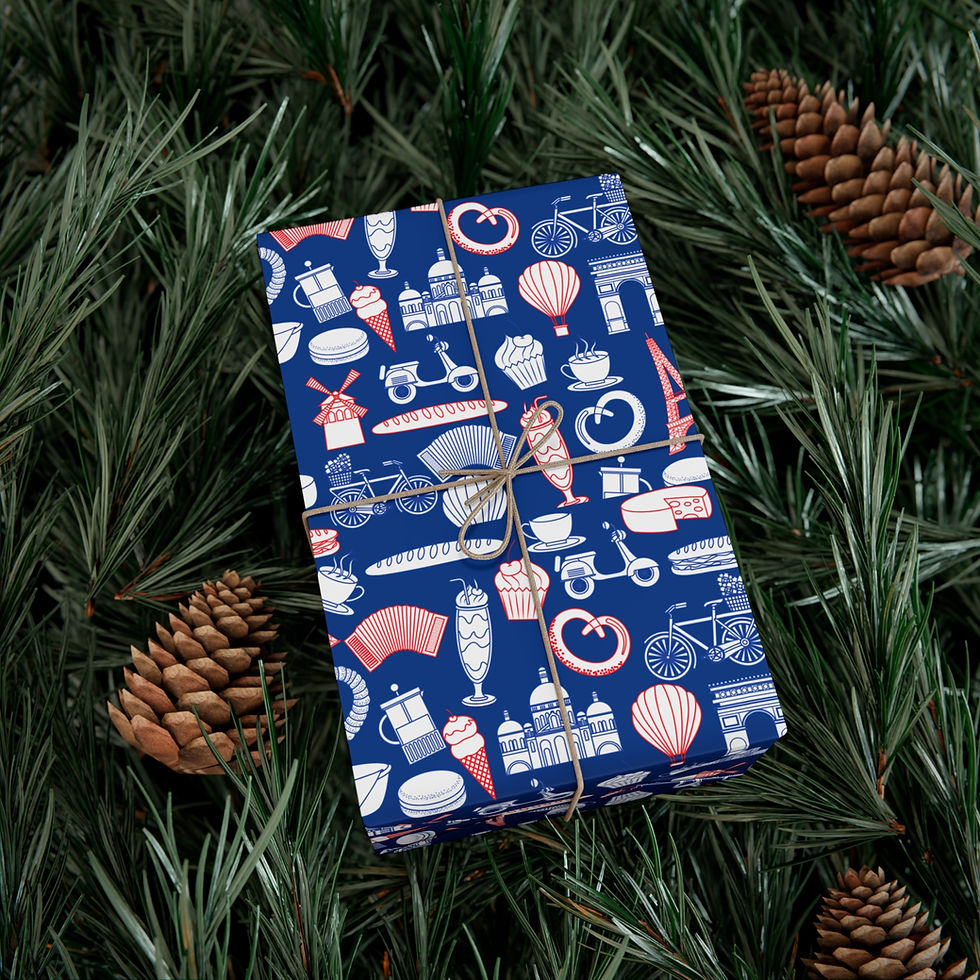 Thumbnail: Gift wrapped in blue travel icons, rope tie on a bed of green evergreen.