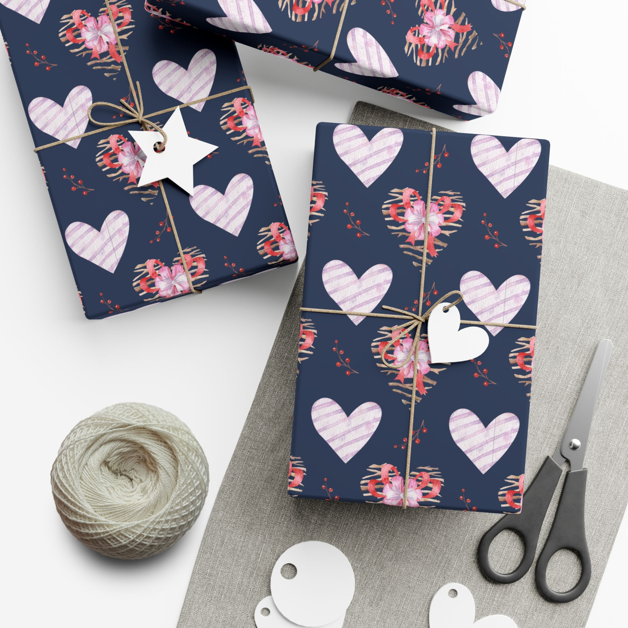 Wrapped gifts with hearts, twine, tags and scissors for a special occasion.