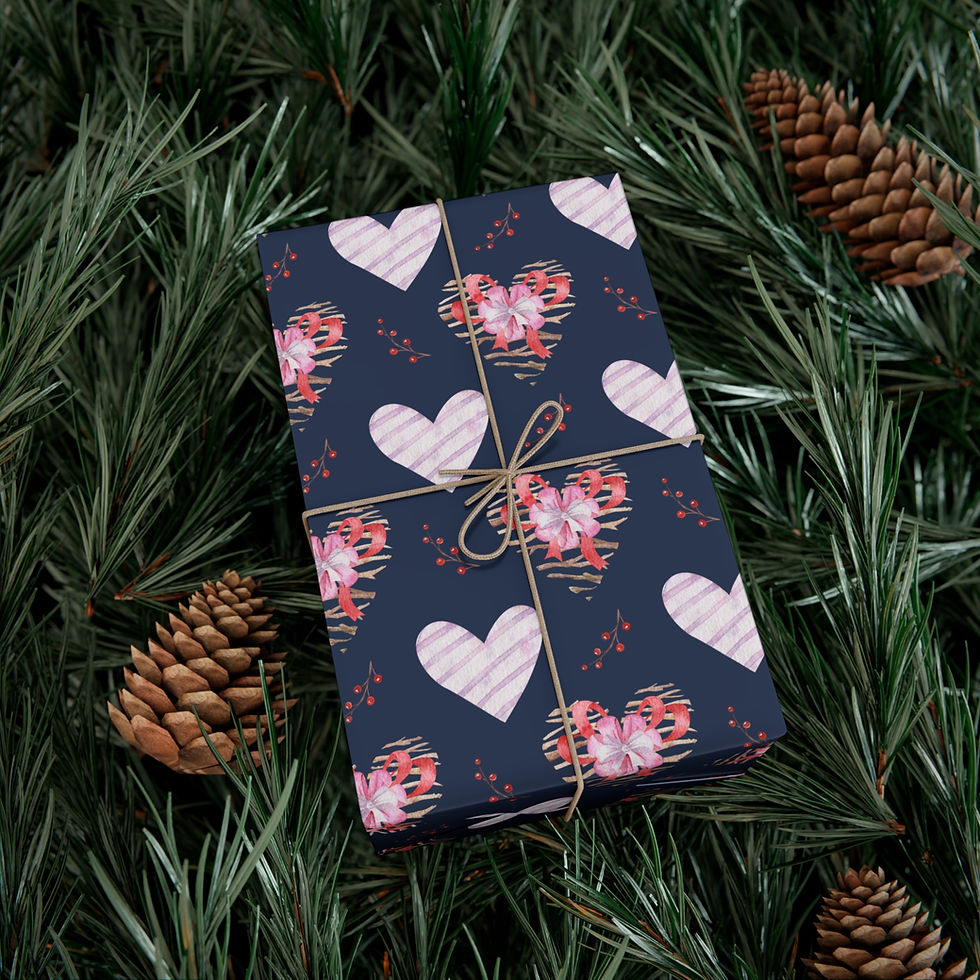 Thumbnail: Gift wrapped with heart pattern sits on green pine tree sprigs and pine cones.