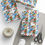 Thumbnail: Wrapped gifts with 'Lebanon' gift wrapping paper, twine, and scissors.