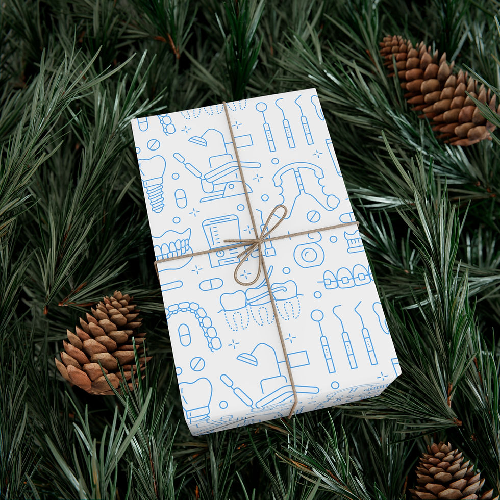 Thumbnail: Dental themed gift wrap with twine bow, surrounded by pine needles and cones.