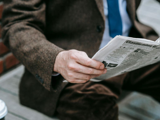 Man reading the market news