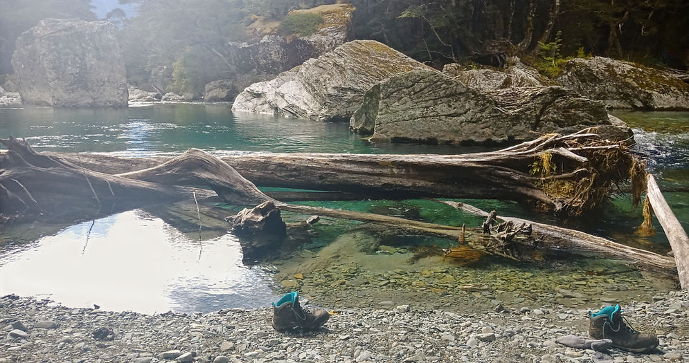 Hiking boots at Routeburn Track swimming hole