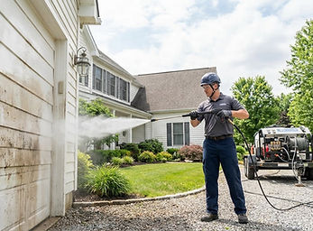 Soft washing system used to protect siding and surfaces
