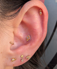 Stacked lobe piercings with fine jewelry by expert piercers near Salem.