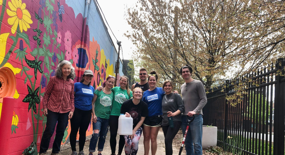 Group posing outside after planting at the Pocket Park