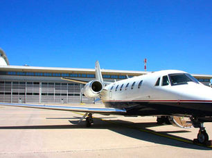 Gabriele Marsetic, Charter Sales Manager at Sardinian Sky Service, using the Private Flight Catering Management Platform interface on a tablet to quickly place a catering order.