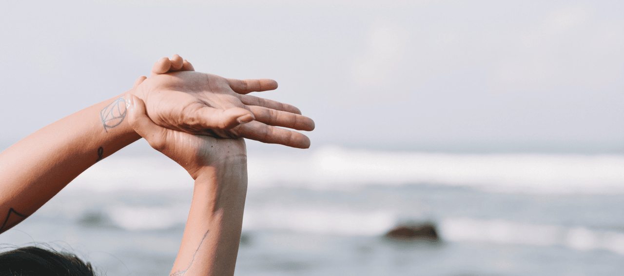 Woman stretching on beach