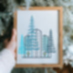 Picture frame with a drawing of buildings