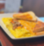 An omelette, hashbrowns, and toast