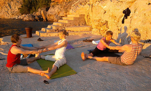Two Couples doing partner yoga during a Suncokret retreat