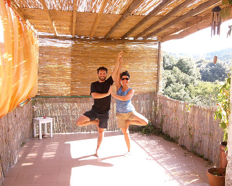 A couple posing in Tree Pose on the Suncokret Yoga Terrace