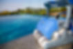 Dolphin Skimmi 200 for pool, robotic cleaner at pool edge
