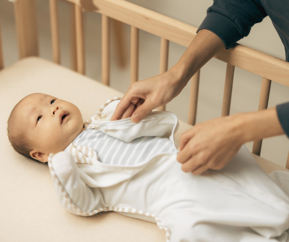 learning how to swaddle a newborn using a zip up style swaddle
