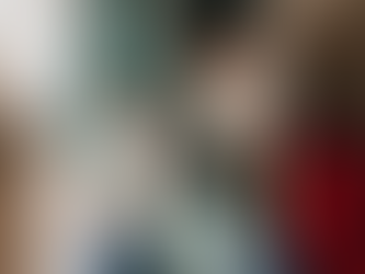 Mother smiling at her sleeping newborn while resting after overnight care support from The Jacksonville Baby Company.