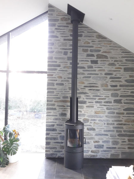 Masport Akaroa Log Burner installed behind a beautiful brick wall in a new Wanaka home