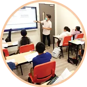 Students engaged in class at AGrader Learning Centre, a tuition centre in Singapore.