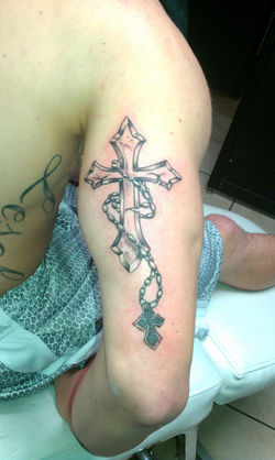 cross and rosery tattoo.jpg