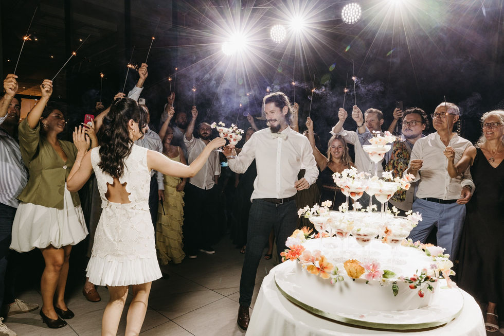 Couple celebrating with champagne at a festive event.