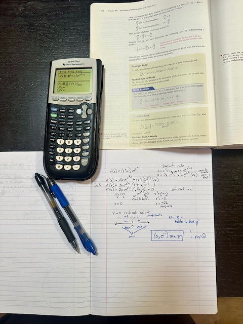 Using product rule to find a derivative and solve for critical points.