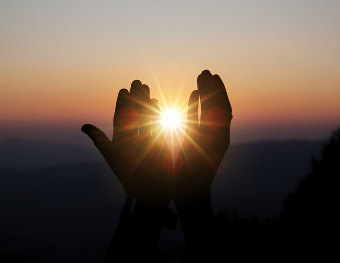 spiritual-prayer-hands-over-sun-shine-with-blurred-beautiful-sunset.jpg