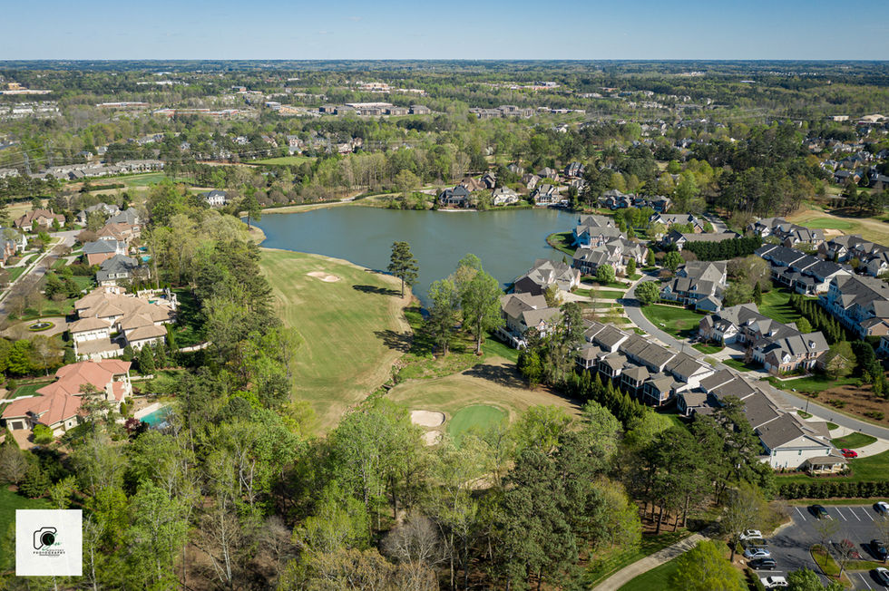 Drone photo of suburban homes and golf course community — Novitsky Photography