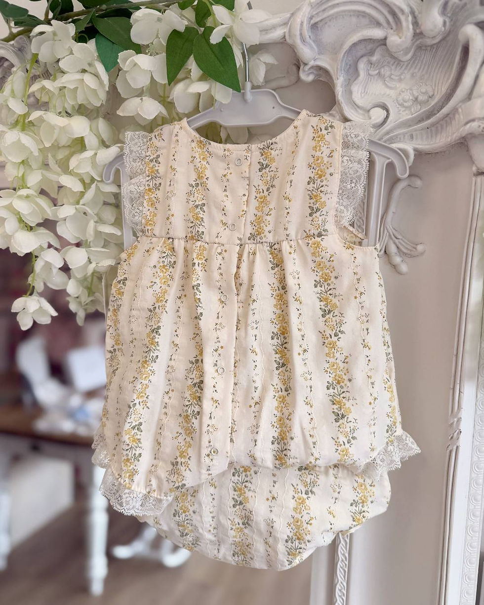 Thumbnail: Rapife lemon floral dress with matching pants, trimmed with ivory lace and a dainty bow on the chest