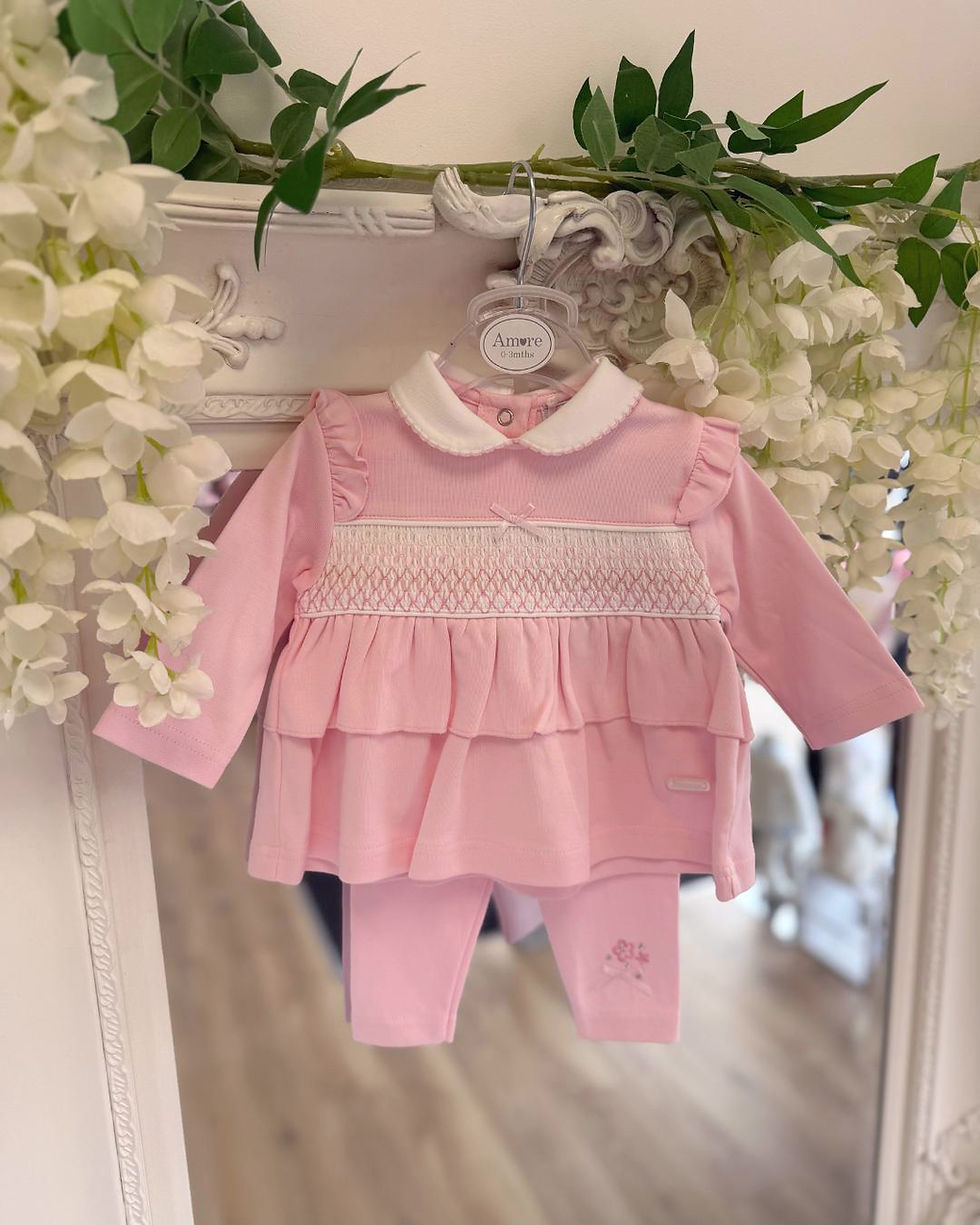 Amore pink smocked blouse paired with pink leggings