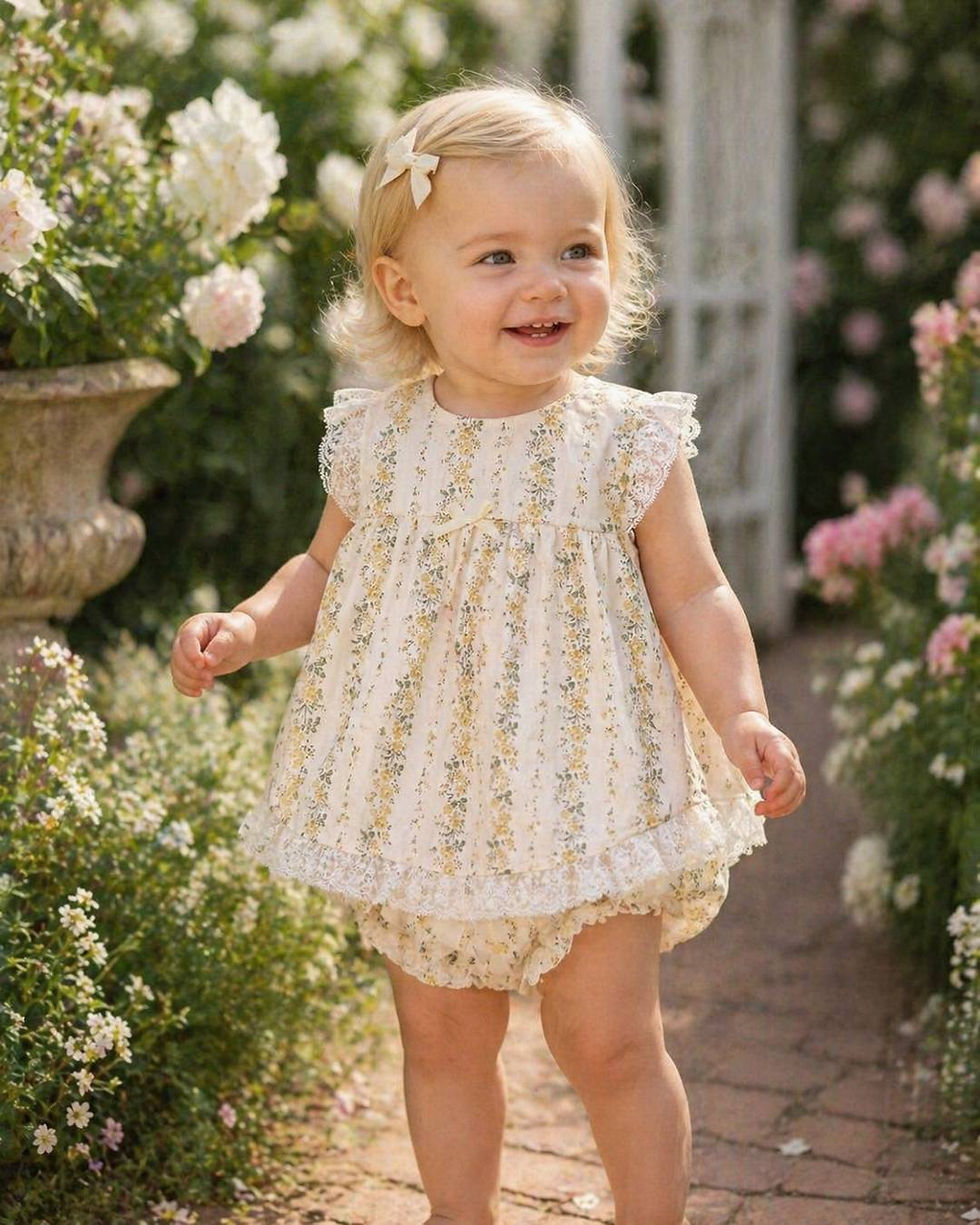 Rapife lemon floral dress with matching pants, trimmed with ivory lace and a dainty bow on the chest