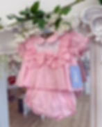 babaine pink dress and pants with frill shoulders and chest bows and embroidered chest detailing