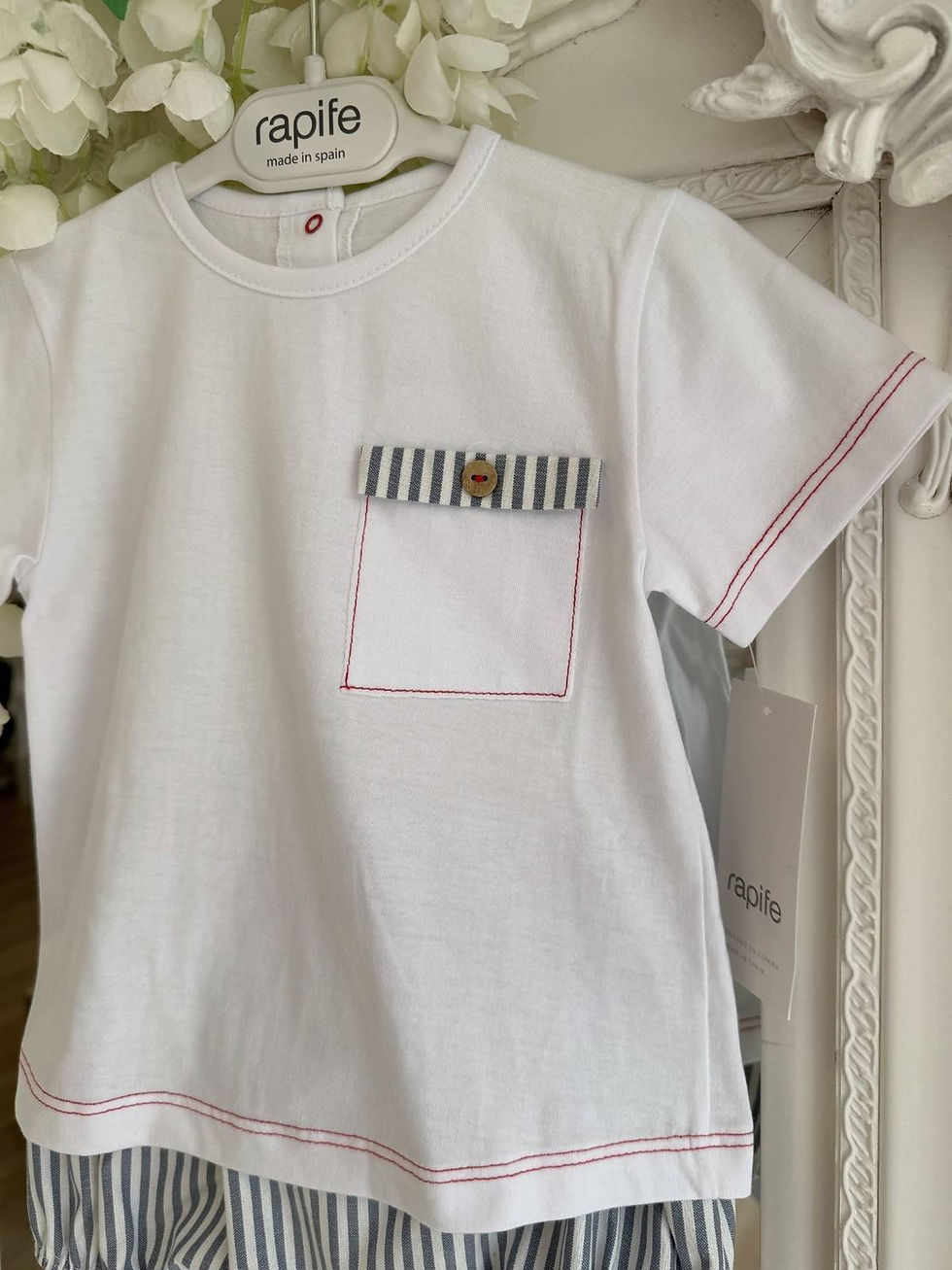Thumbnail: Rapife nautical navy stripe shorts and white tee with red stitch trims. A chest pocket detailing with stripes and red trims