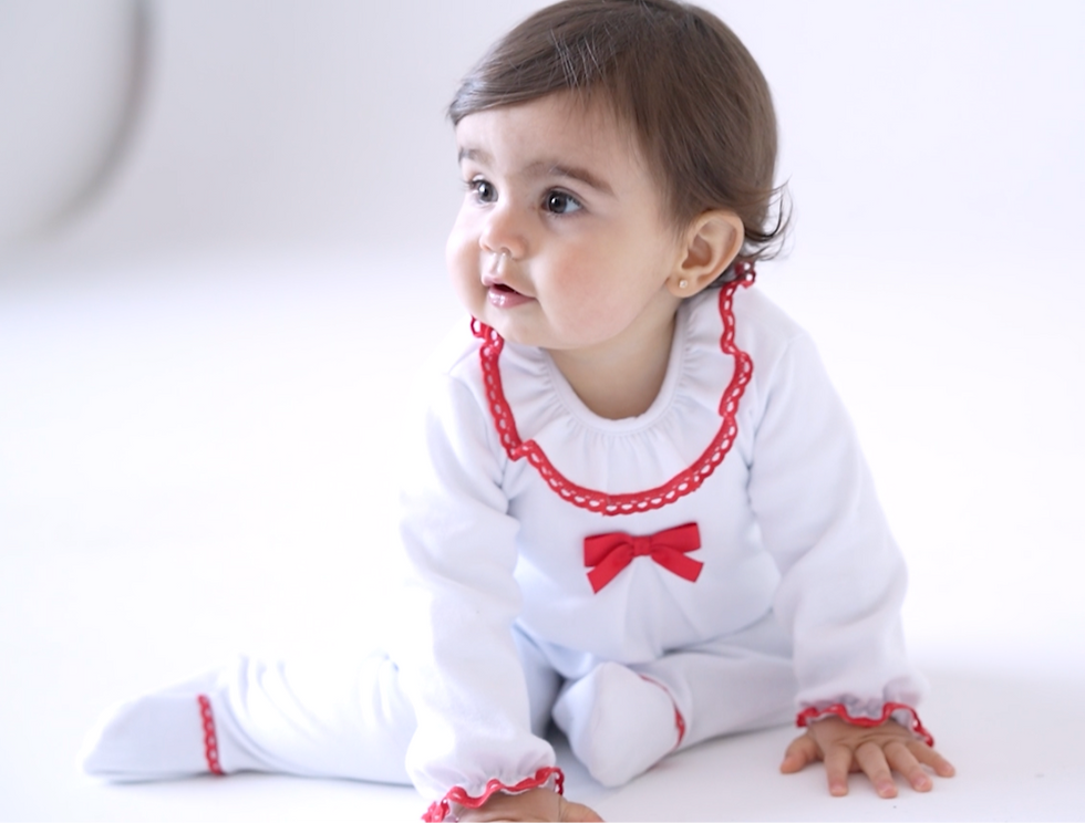Rapife white top and footed trousers with Red Ruffle  trims and Bow chest