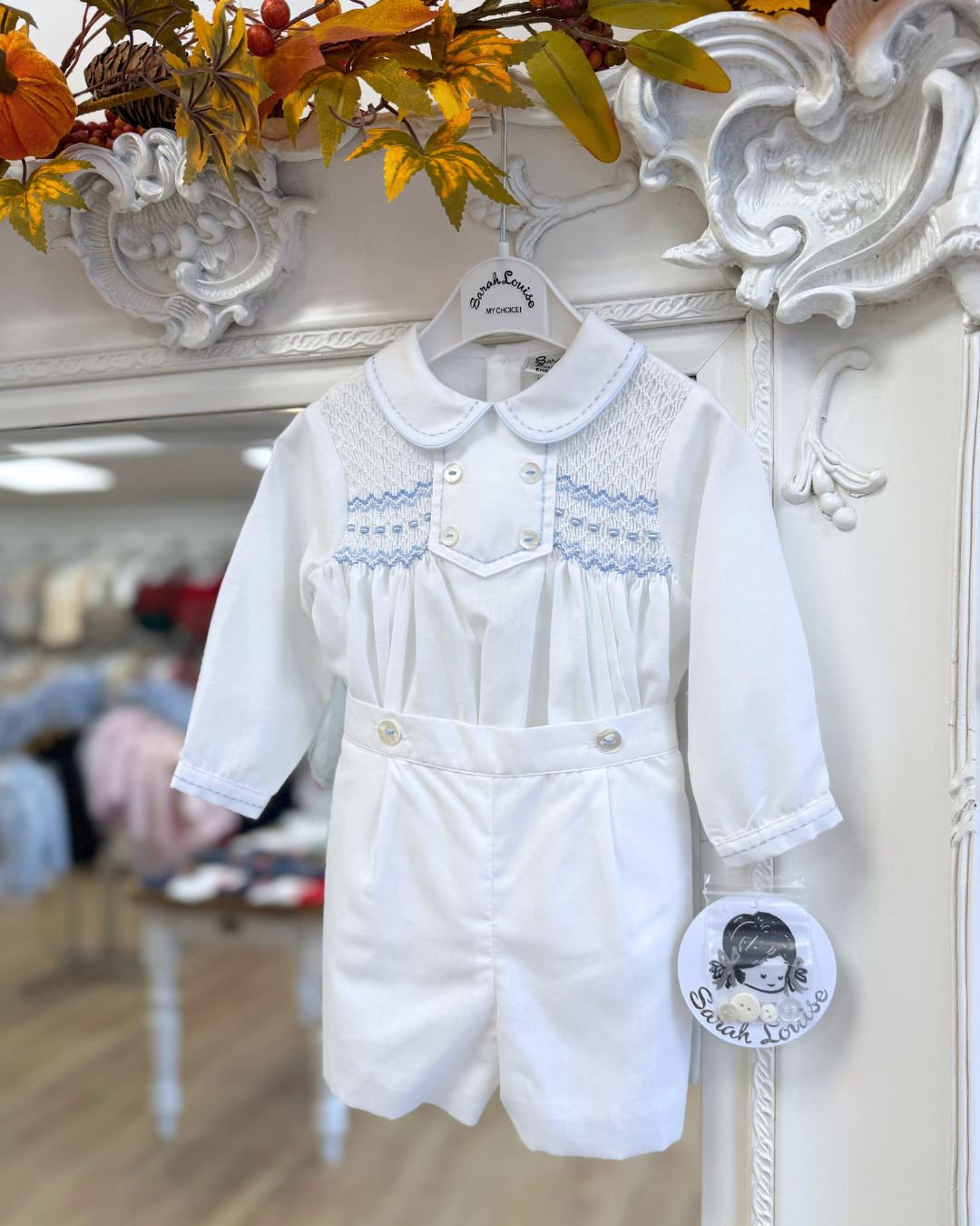 Sarah Louise hand-smocked long-sleeved shirt with delicate pastel blue embroidery and a coordinating pair of matching shorts