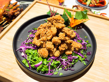 Crispy fried chicken on a bed of shredded cabbage
