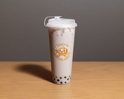 Bubble tea drink with boba pearls and Tama Kaei logo