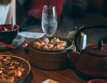 Steaming dumplings in bamboo steamer with tea pot at 168 szechuan restaurant