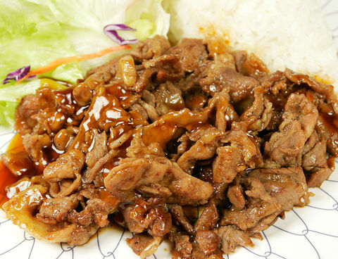 Savory teriyaki beef with rice and vegetables on a plate Teriyaki Plus.