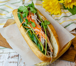 Vietnamese Banh Mi sandwich with fresh herbs and pickled vegetables