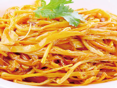 Savory Asian-style noodles dish, garnished with fresh cilantro, ready to serve.