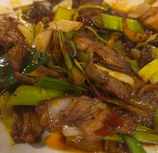 Close-up dish of meat and green onions, Axia Chinese Bistro.