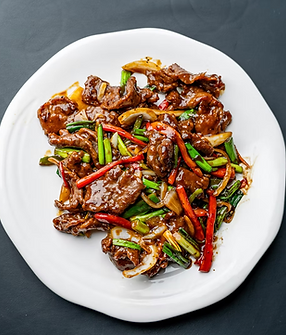 Beef and vegetables on a white plate, Lao Sze Chuan Pittsburgh's delicious dish.
