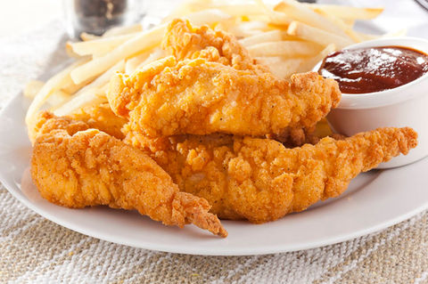 Fried chicken tenders with french fries and dipping sauce