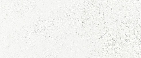 White, subtly textured background close-up with rough, uneven stucco-like surface.