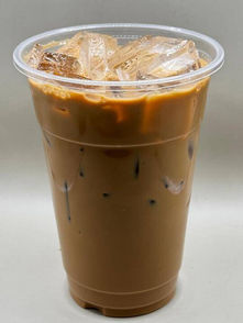Iced coffee with ice cubes in a clear plastic cup.
