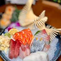 Delicious sashimi platter with fresh salmon, tuna, and Yoi Sushi.